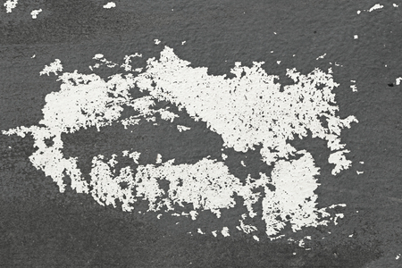 Old Flaky Paint Peeling off a Grungy Cracked Wall. Cracks, Peeling Old Paint and Plaster on Background of Old Cement Wall. White and Gray Spots of Paint. An Old Cement Stone Wall as Vintage Cracked.の写真素材