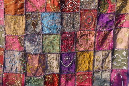 Patchwork of indium. India embroidery colored squares. Bright multicolored Indian oriental background.の写真素材