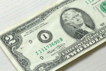Two dollars with one note. 2 dollars with one banknote.の写真素材