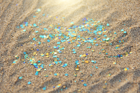 Green, blue or turquoise Soft Blurred Boke Background. Spangles and Shiny Silver Color Background. Bright Background. Glamorous background for your design and decoration. Sparkles on the sand. Magic.の写真素材
