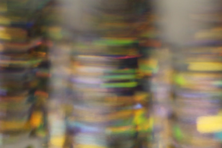 Blurred abstract creative background. Green, yellow, blue background. Lens flare. Colorful bokeh light. Illuminated burst of multicolor light. Lights of the night and evening city. Colorful divorces.の写真素材