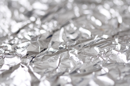 Foil. Metal crumpled background. Gray or silver background.の写真素材