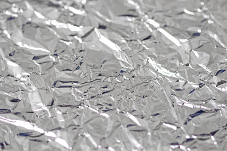 Foil. Metal crumpled background. Gray or silver background.の写真素材