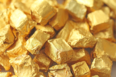 Golden Background. Ingots or Nuggets of Pure Gold. Gold leaf. Tea Resin Puer.の写真素材
