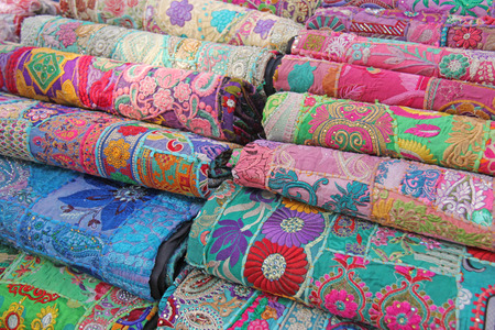 Bright colored fabrics India ornaments and oriental drawings. It is built on the market. Hand...