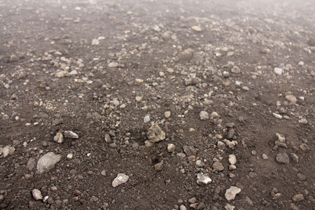 Background of Small Stones. Stones from Mount Etna. The island of Sicily, Italy. Volcanic rock. Volcanic Lava. Stone Texture for Design, Templates and Decoration.の写真素材