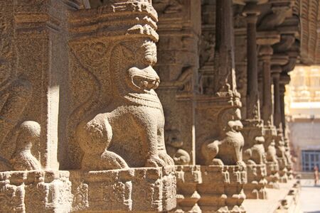 Stone bas-reliefs on the column in Shiva Virupaksha Temple, Hampi. Carving stone ancient background....