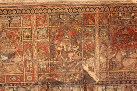 Frescoes and ancient drawings paintings and scenes on the ceiling in Shiva Virupaksha Temple. Ancient terracotta patterns.の写真素材