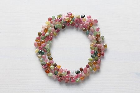 Natural stone tourmaline. Beautiful card for congratulations. A circle of natural stones. Blue,...