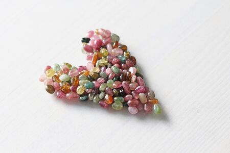 Heart. Beautiful heart made of natural stone tourmaline. Heart on a white background. Greeting card...