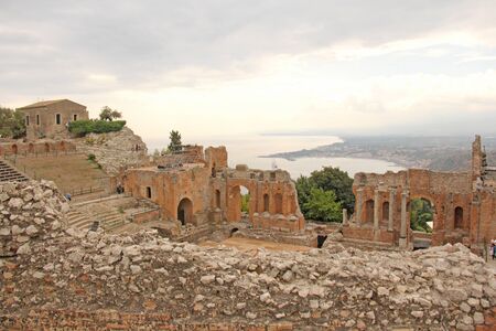 Greek Theater in the City of Taormina, Sicily Island, Italy. Old and Ancient Stone Ruins.の写真素材