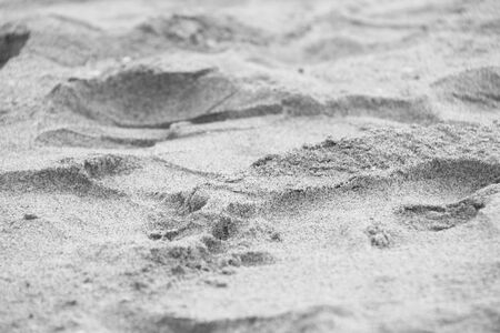 Abstract sand background. Beautiful beach gray sand, wallpaper texture.