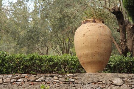 Large Ceramic Terracotta Pot in the Park. Botanical Garden of Taormina. The island of Sicily, Italy.の写真素材