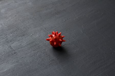 Sample coronavirus model on black modern background. Coronavirus outbreak, coronaviruses influenza background as dangerous flu strain cases as pandemic medical health risk. Microscope virus close up.の写真素材