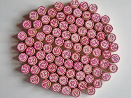 Russian lotto, bingo board game, barrels and cards on a white background. Quarantine Games Concept. Board game lotto with wooden barrels. Money game, luck, luck, excitement, board games, stay home.の写真素材