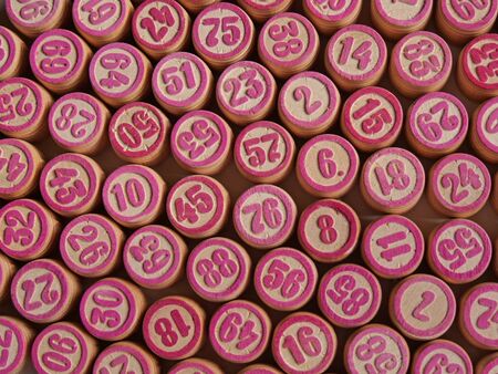 Russian lotto, bingo board game, barrels and cards on a white background. Quarantine Games Concept. Board game lotto with wooden barrels. Money game, luck, luck, excitement, board games, stay home.の写真素材