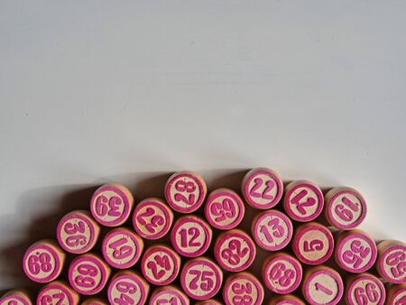 Russian lotto, bingo board game, barrels and cards on a white background. Quarantine Games Concept. Board game lotto with wooden barrels. Money game, luck, luck, excitement, board games, stay home.の写真素材