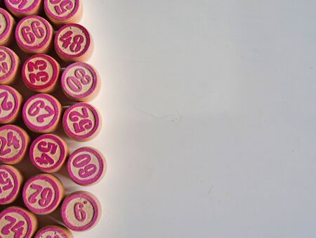 Russian lotto, bingo board game, barrels and cards on a white background. Quarantine Games Concept. Board game lotto with wooden barrels. Money game, luck, luck, excitement, board games, stay home.の写真素材