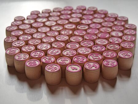 Russian lotto, bingo board game, barrels and cards on a white background. Quarantine Games Concept. Board game lotto with wooden barrels. Money game, luck, luck, excitement, board games, stay home.の写真素材