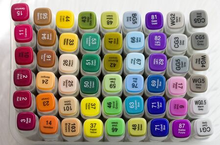 Set of bright multi-colored felt-tip pens or markers with designation of numbers and the name of color. Photo for creativity, drawing for children, design. Many Markers of all colors of the rainbow.の写真素材