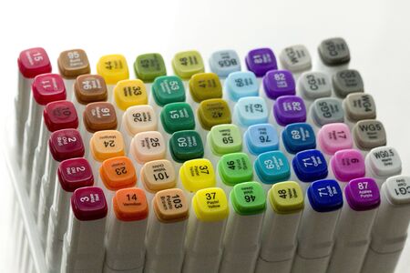 Set of bright multi-colored felt-tip pens or markers with designation of numbers and the name of color. Photo for creativity, drawing for children, design. Felt pens of all colors of the rainbow.の写真素材
