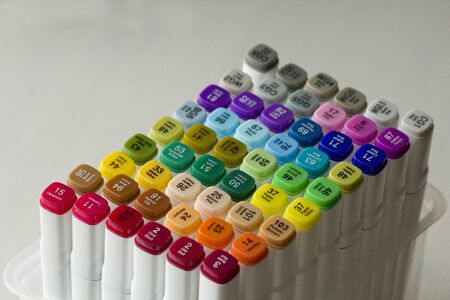 Set of bright multi-colored felt-tip pens or markers with designation of numbers and the name of color. Photo for creativity, drawing for children, design. Felt pens of all colors of the rainbow.の写真素材