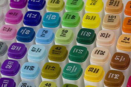 Set of bright multi-colored felt-tip pens or markers with designation of numbers and the name of color. Photo for creativity, drawing for children, design. Many Markers of all colors of the rainbow.の写真素材