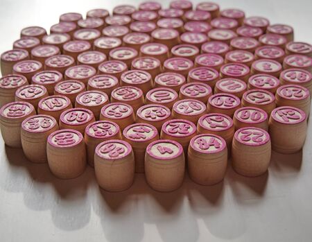 Russian lotto, bingo board game, barrels and cards on a white background. Quarantine Games Concept. Board game lotto with wooden barrels. Money game, luck, luck, excitement, board games, stay home.の写真素材