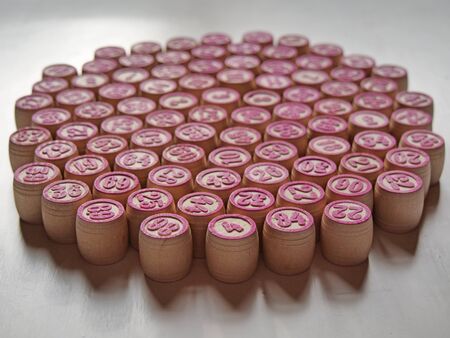 Russian lotto, bingo board game, barrels and cards on a white background. Quarantine Games Concept. Board game lotto with wooden barrels. Money game, luck, luck, excitement, board games, stay home.の写真素材