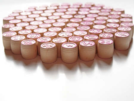 Russian lotto, bingo board game, barrels and cards on a white background. Quarantine Games Concept. Board game lotto with wooden barrels. Money game, luck, luck, excitement, board games, stay home.の写真素材