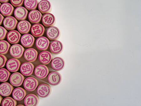 Russian lotto, bingo board game, barrels and cards on a white background. Quarantine Games Concept. Board game lotto with wooden barrels. Money game, luck, luck, excitement, board games, stay home.の写真素材