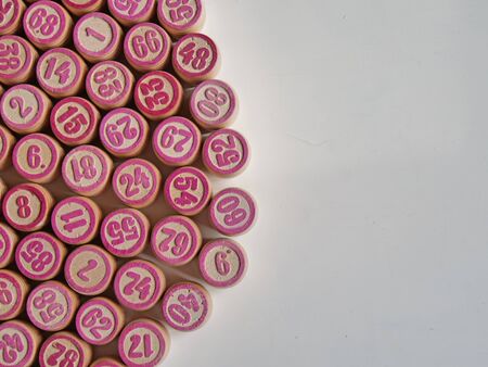 Russian lotto, bingo board game, barrels and cards on a white background. Quarantine Games Concept. Board game lotto with wooden barrels. Money game, luck, luck, excitement, board games, stay home.の写真素材