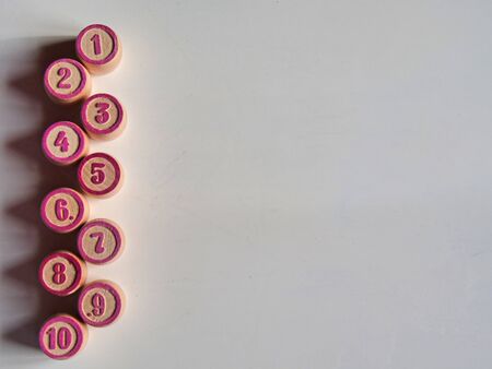 Russian lotto, bingo board game, barrels and cards on a white background. Quarantine Games Concept. Board game lotto with wooden barrels. Money game, luck, luck, excitement, board games, stay home.の写真素材