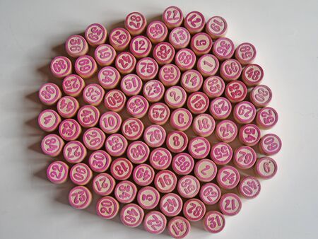 Russian lotto, bingo board game, barrels and cards on a white background. Quarantine Games Concept. Board game lotto with wooden barrels. Money game, luck, luck, excitement, board games, stay home.の写真素材