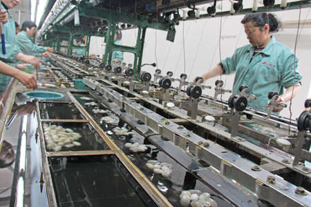 China, Suzhou - April 16, 2012.Silk factory in China.のeditorial素材
