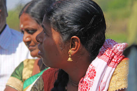 India, Hampi, 01 February 2018. Indian woman, close-up portrait, earrings in girl's ears.のeditorial素材