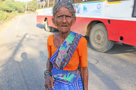 India, Hampi, January 31, 2018. An old Indian woman or an old woman in wrinkles looks at the camera.のeditorial素材