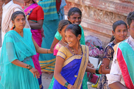 India, Hampi, 01 February 2018. A group of Indian women smiling on a street in the village of Hampi, inside the temple of Virupaksha.のeditorial素材