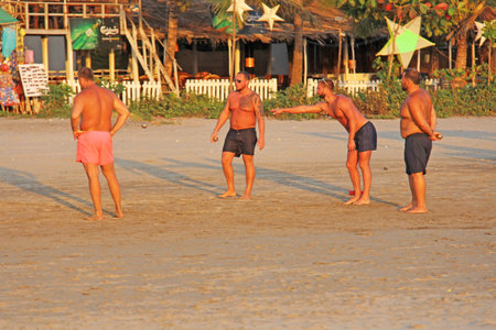 India, GOA, January 24, 2018. Street game petanque. Men play in Petang on the beach in India. Men with bare chest.のeditorial素材