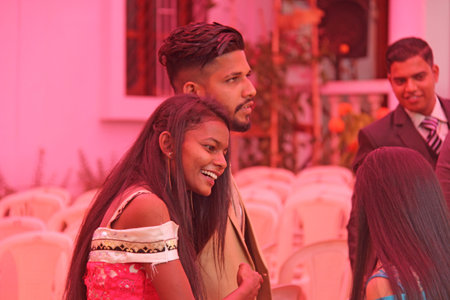 India, GOA, January 28, 2018. The streets of India. People go or ride a scooter down the street. Bright colors of India. Holiday in India.のeditorial素材