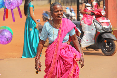 India, GOA, January 28, 2018. Indian elderly woman or grandmother in pink and blue saris, in India.のeditorial素材