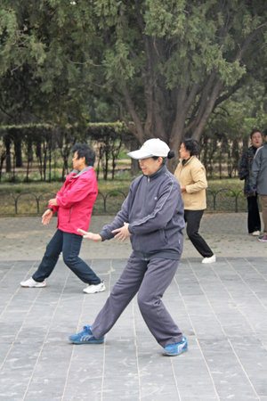 China, Beijing - April 10, 2012. Qigong in China. Qigong in the park Temple of the sky.のeditorial素材
