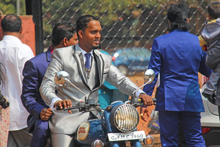 India, GOA, January 28, 2018. A young Indian man on a scooter in India.のeditorial素材