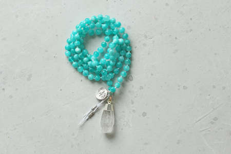 Rosary mala 108 beads from natural stones Amazonite. Author's jewelry from natural stones, Buddhism, mantra, prayer, rosary from stones for prayer and beauty. Long beads from natural stones, necklace.の写真素材