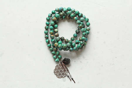 Rosary mala 108 beads from natural stones Chrysocolla Turquoise. Author's jewelry from natural stones, Buddhism, mantra, prayer, rosary from stones for prayer, beauty. Long beads from stones necklace.の写真素材