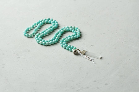 Rosary mala 108 beads from natural stones Amazonite. Author's jewelry from natural stones, Buddhism, mantra, prayer, rosary from stones for prayer and beauty. Long beads from natural stones, necklace.の写真素材