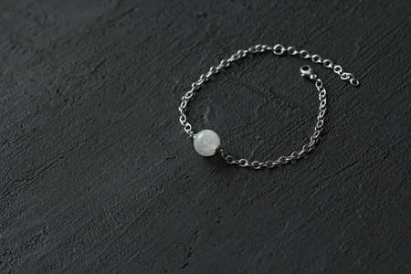 Chrome diopside bracelet. A bracelet made of stones on a hand from natural stone Chrome diopside. Bracelet made of natural stones. Handmade jewelry. Handmade bracelets on light modern background.の写真素材