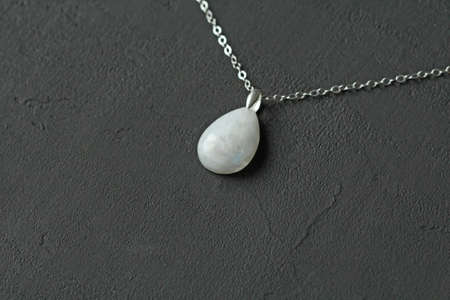 Chrome diopside bracelet. A bracelet made of stones on a hand from natural stone Chrome diopside. Bracelet made of natural stones. Handmade jewelry. Handmade bracelets on light modern background.の写真素材