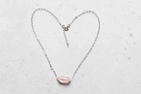 Chrome diopside bracelet. A bracelet made of stones on a hand from natural stone Chrome diopside. Bracelet made of natural stones. Handmade jewelry. Handmade bracelets on light modern background.の写真素材