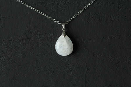 Bright multicolored bracelet. Ruby, coral, carnelian, citrine, emerald, apatite, amazonite, turquoise, lapis lazuli, tanzanite, black spinel. Handmade jewelry bracelets on light modern background.の写真素材